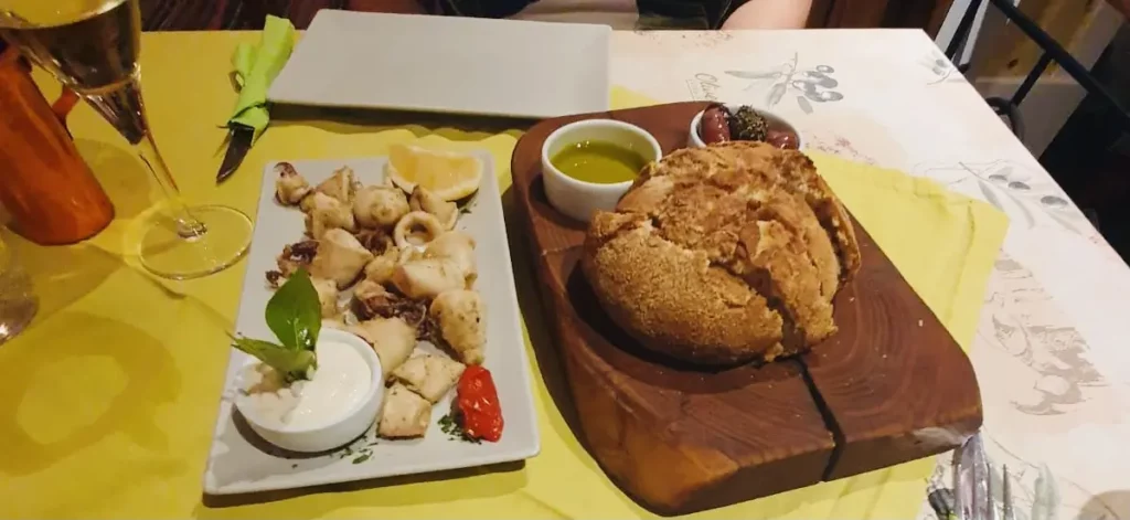 The fresh bread with dips and calamari are best washed down with a glass of white wine when visiting the traditional greek restaurant of Avli in Kardamena, Kos