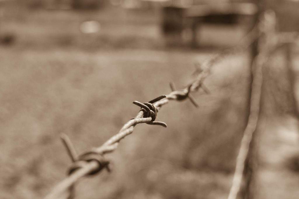 Sobibor, a must visit Holocaust site- barbed wire, grey fence, concentration camp