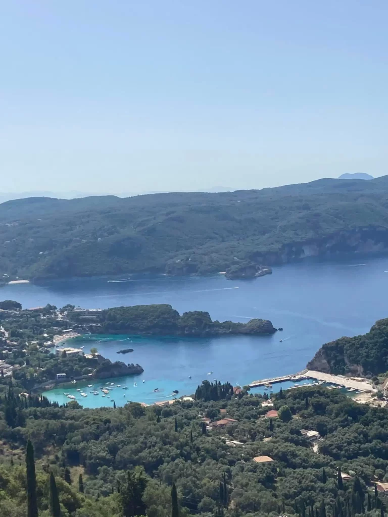 What is the best route for driving from Corfu Airport to Kassiopi?-green cliffside views, blue waters in Corfu