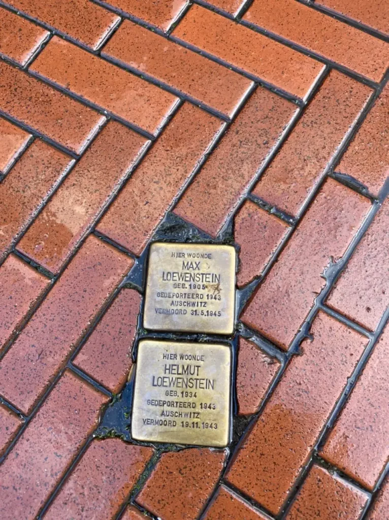 3 days in Amsterdam Itinerary, Holocaust and Jewish Tour- brown cobbles, gold plates in ground with Jewish Holocaust victims names on, Netherlands