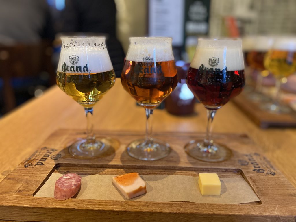 spending 3 days in Amsterdam, Dutch Brown Bars- board with 3 beers on it, dark beer, light beer, amber beer, cheese