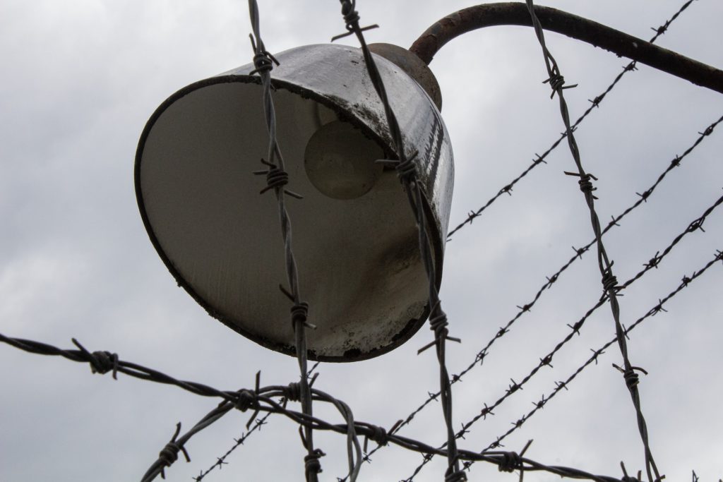 Dachau tour, best Holocaust Tours Germany-barbed wire, street light