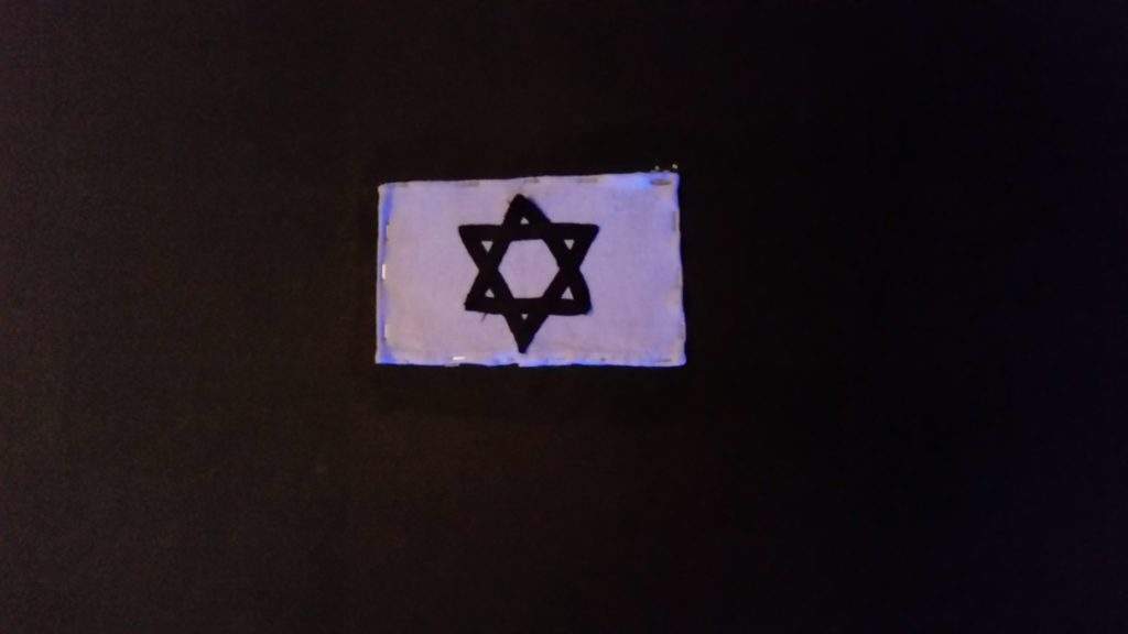 History walking tour in Berlin, Holocaust tours Germany- black jewish star, black background