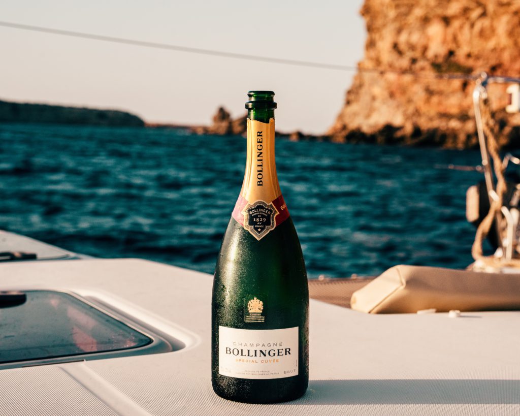 Luxury Private Corfu Sea Tour with Cocktails- champagne, luxury boat, blue sea, rocks