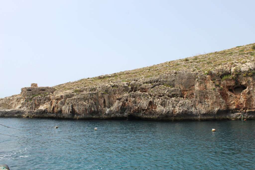 Best Private Tours To Explore Maltas top Sites- blue waters surrounded by small cliff edges near Maltas top water sites
