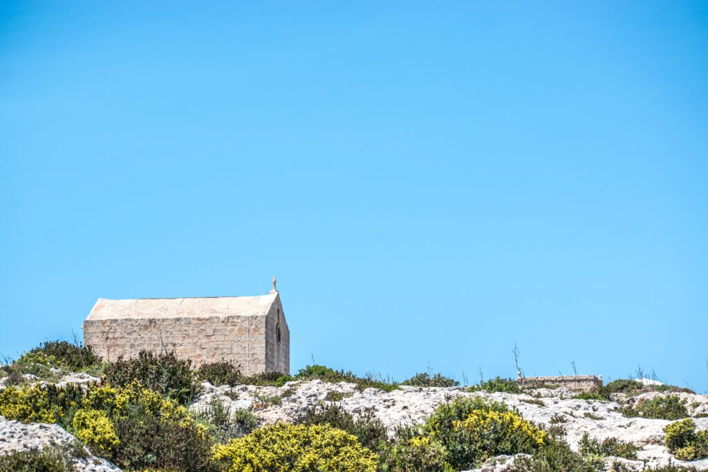 best private tours to explore Malta, church overlooking the sea, sitting on the cliffs in Malta