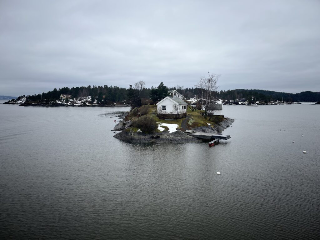 A white house on an Island amongst the Fjords in Iceland